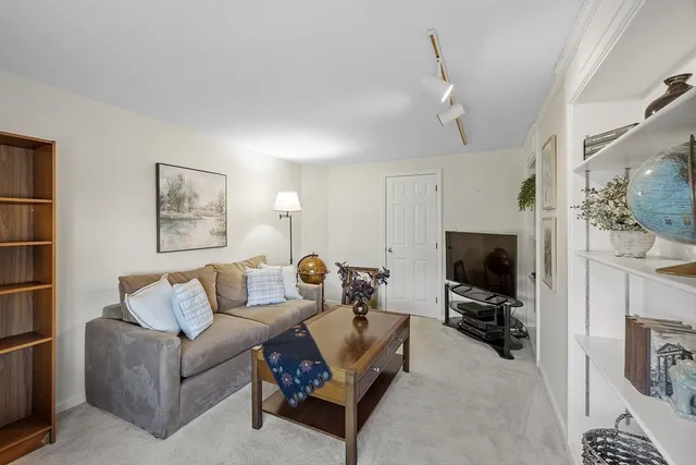 a bathroom with a toilet a sink and a mirror