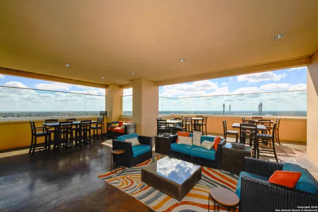 a dining room with furniture window and outside view
