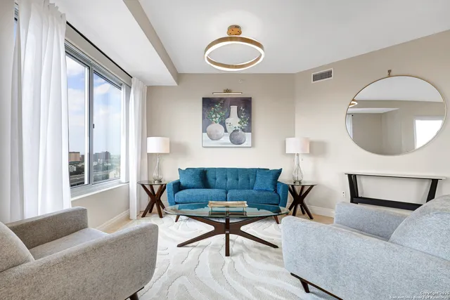 a bedroom with a bed and a lamp on table