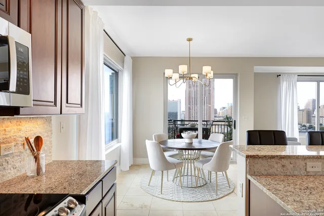 a living room with furniture and a chair