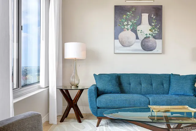 a bedroom with a bed and a lamp