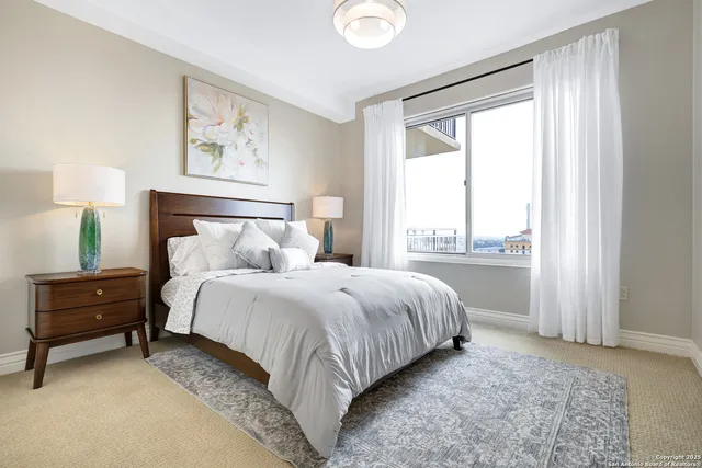 a bathroom with a granite countertop sink a toilet and mirror