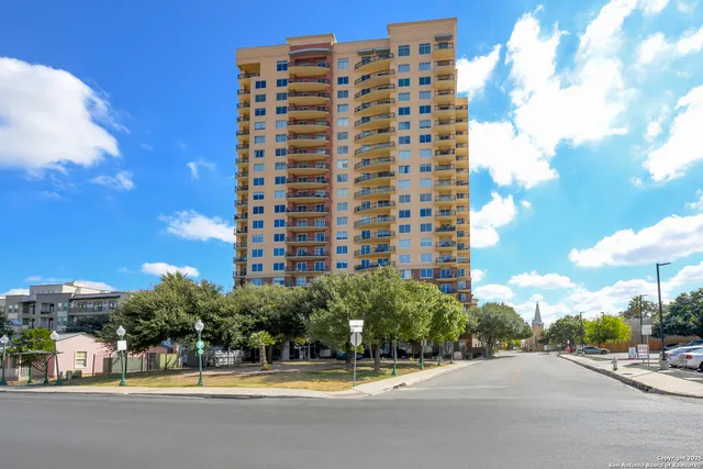 a view of street with a building on the roadside