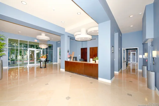 a view of a patio with couches table and chairs and potted plants