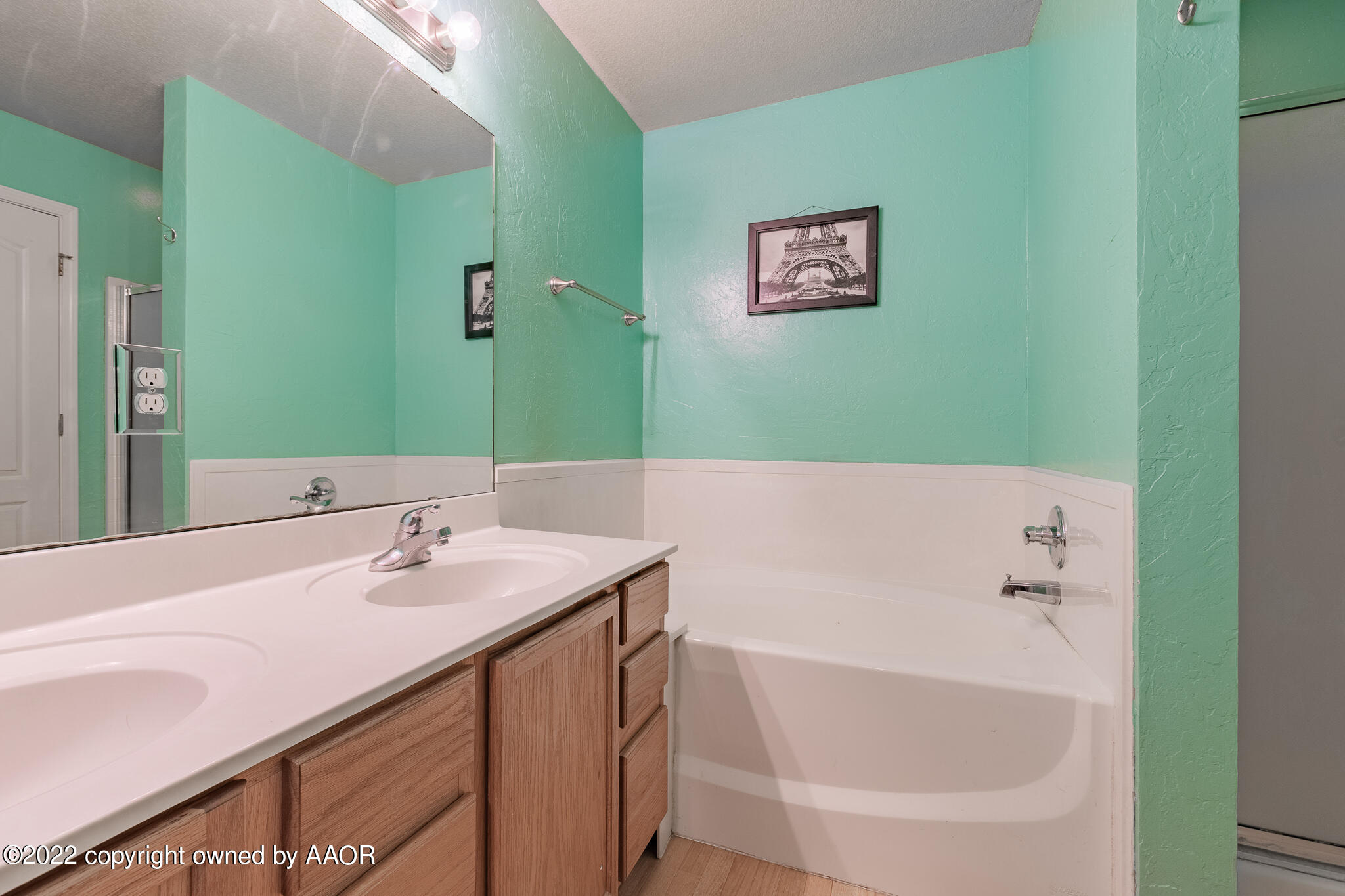 4726 Capulin Lane Amarillo, TX 79110 - Photo 14 of 28 a bathroom with a bathtub and a sink