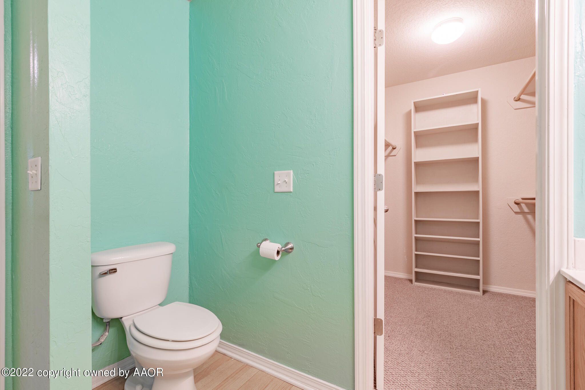 4726 Capulin Lane Amarillo, TX 79110 - Photo 15 of 28 a bathroom with a toilet and a sink