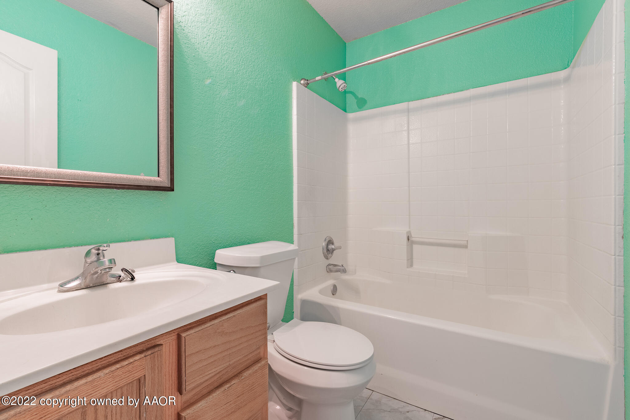 4726 Capulin Lane Amarillo, TX 79110 - Photo 20 of 28 a bathroom with a sink and a mirror