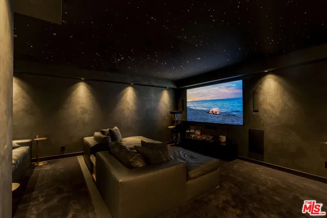 a view of swimming pool with a lounge chairs