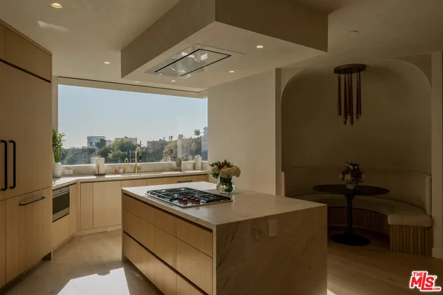 a kitchen with a stove and a refrigerator