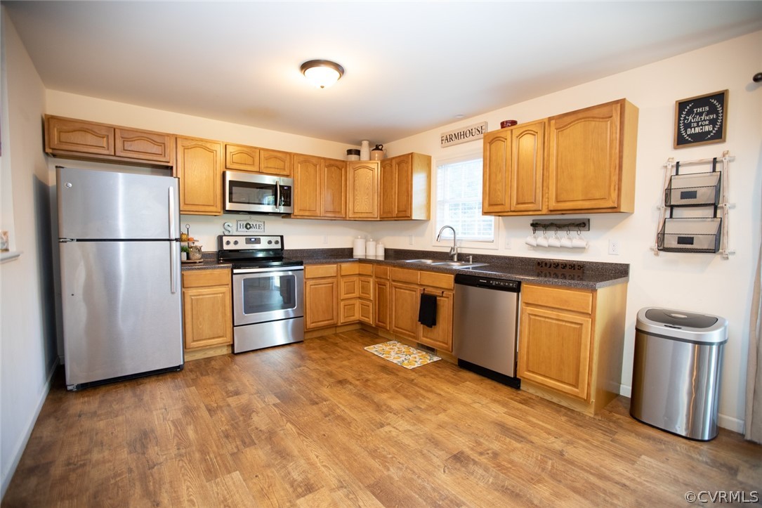135 Mil-Scott Road Farmville, VA 23901 - Photo 12 of 46 a kitchen with a sink cabinets stainless steel appliances and a window