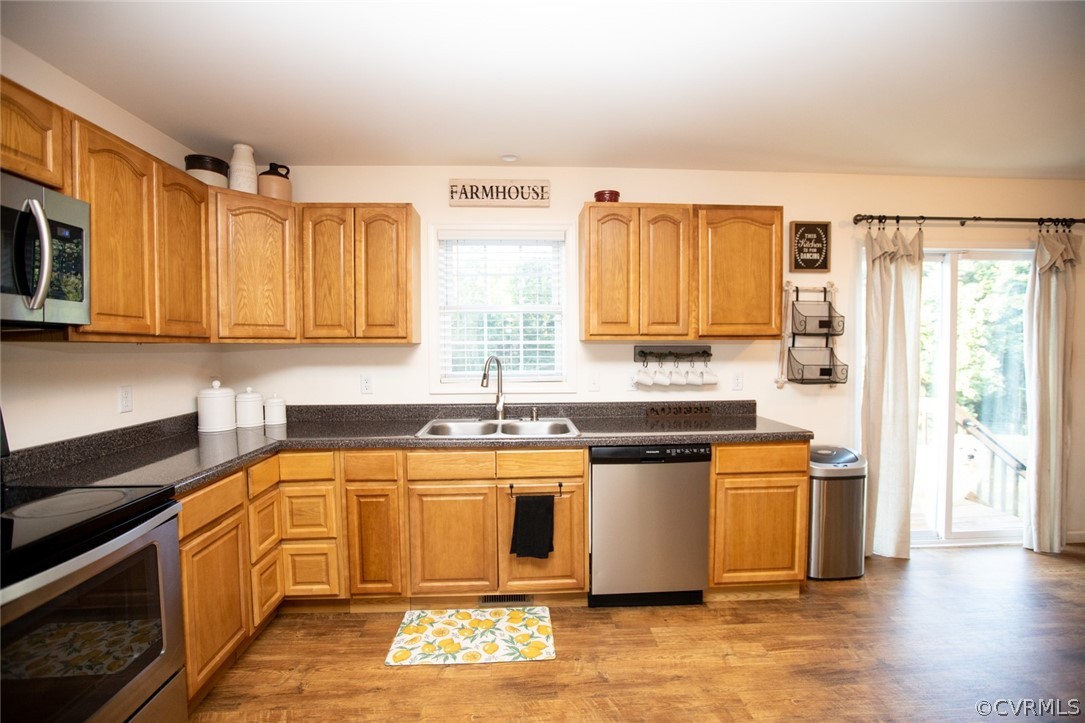 135 Mil-Scott Road Farmville, VA 23901 - Photo 13 of 46 a kitchen with stainless steel appliances granite countertop a stove a sink and a microwave