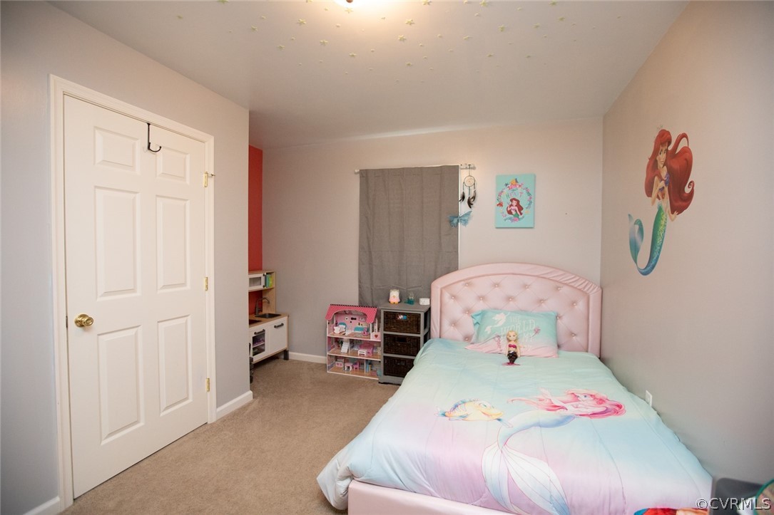 135 Mil-Scott Road Farmville, VA 23901 - Photo 27 of 46 a bedroom with a bed and wooden floor