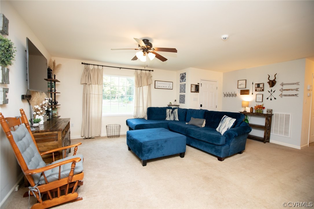135 Mil-Scott Road Farmville, VA 23901 - Photo 5 of 46 a living room with furniture a ceiling fan and a window
