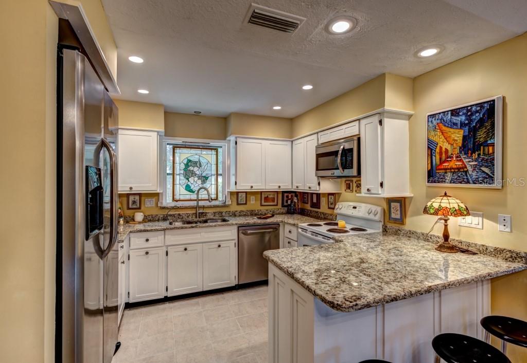 1453 Nantucket Road Venice, FL 34293 - Photo 15 of 35 Rich granite counters and abundant storage and prep space are sure to please the chef of the family.