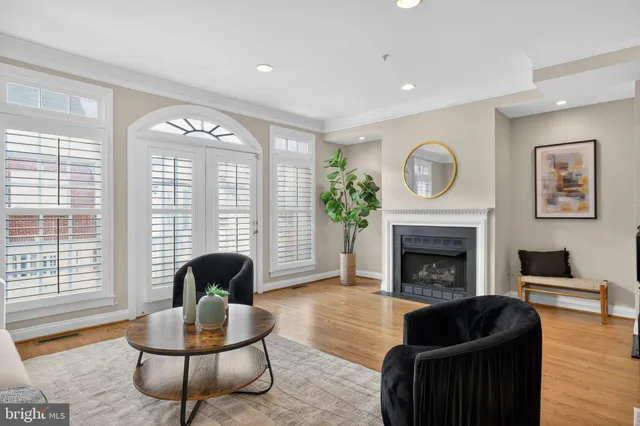 a kitchen with stainless steel appliances granite countertop a stove a sink a refrigerator a microwave and cabinets