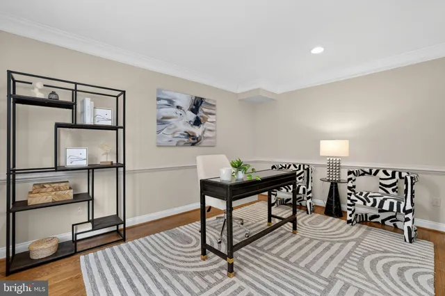 a view of a hallway with entryway wooden floor and front door