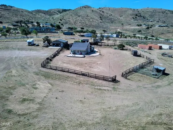 a view of a dry yard with mountain