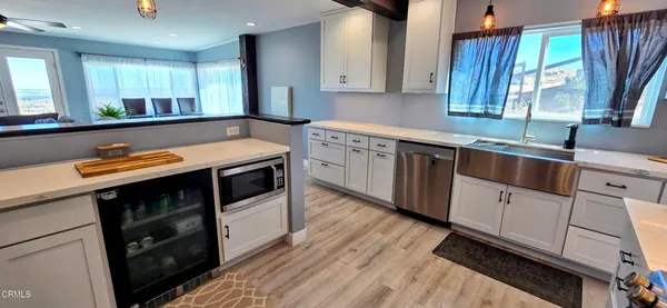 a kitchen with stainless steel appliances sink and cabinets