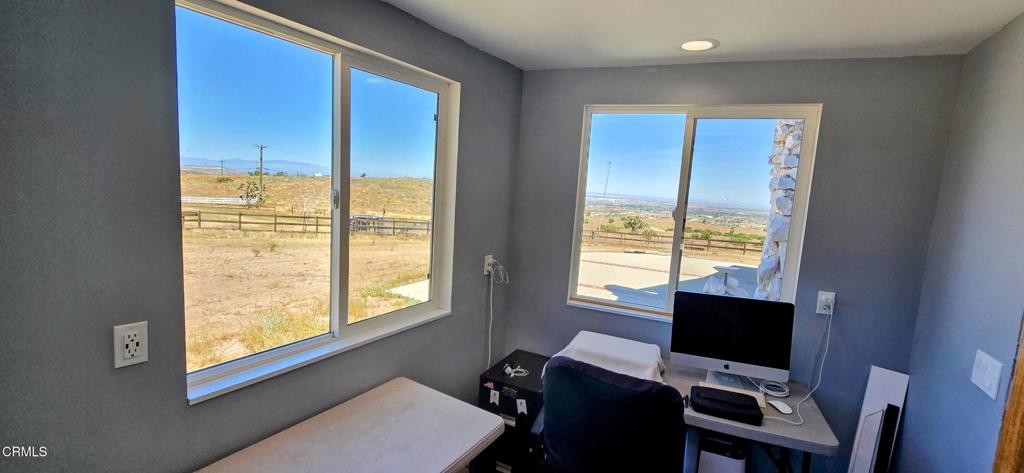 1834 East Carson Mesa Road Palmdale, CA 93550 - Photo 24 of 39 a view of a workspace with a window
