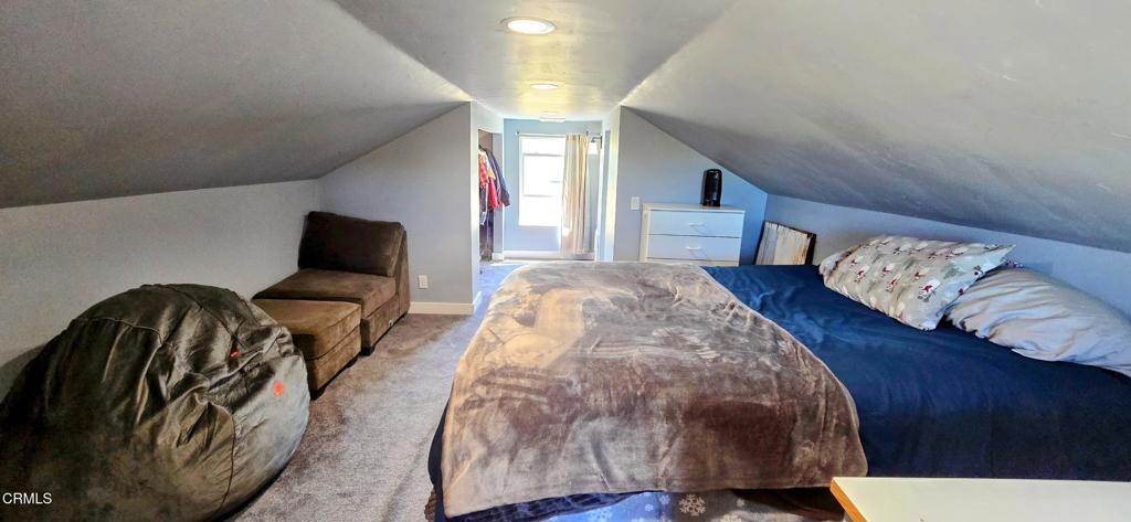 1834 East Carson Mesa Road Palmdale, CA 93550 - Photo 26 of 39 a bedroom with bed and a night stand