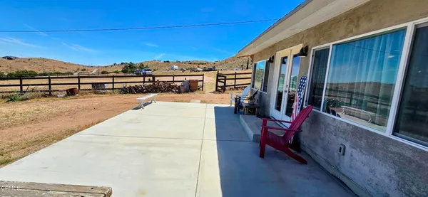 a view of a terrace with chairs