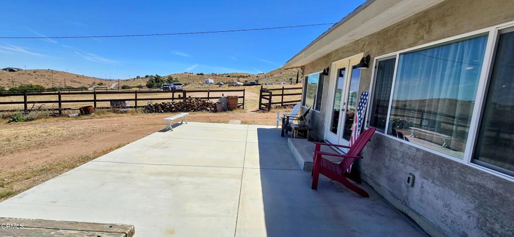 1834 East Carson Mesa Road Palmdale, CA 93550 - Photo 3 of 39 a view of a terrace with chairs