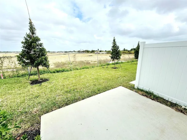 a view of a lake with a big yard