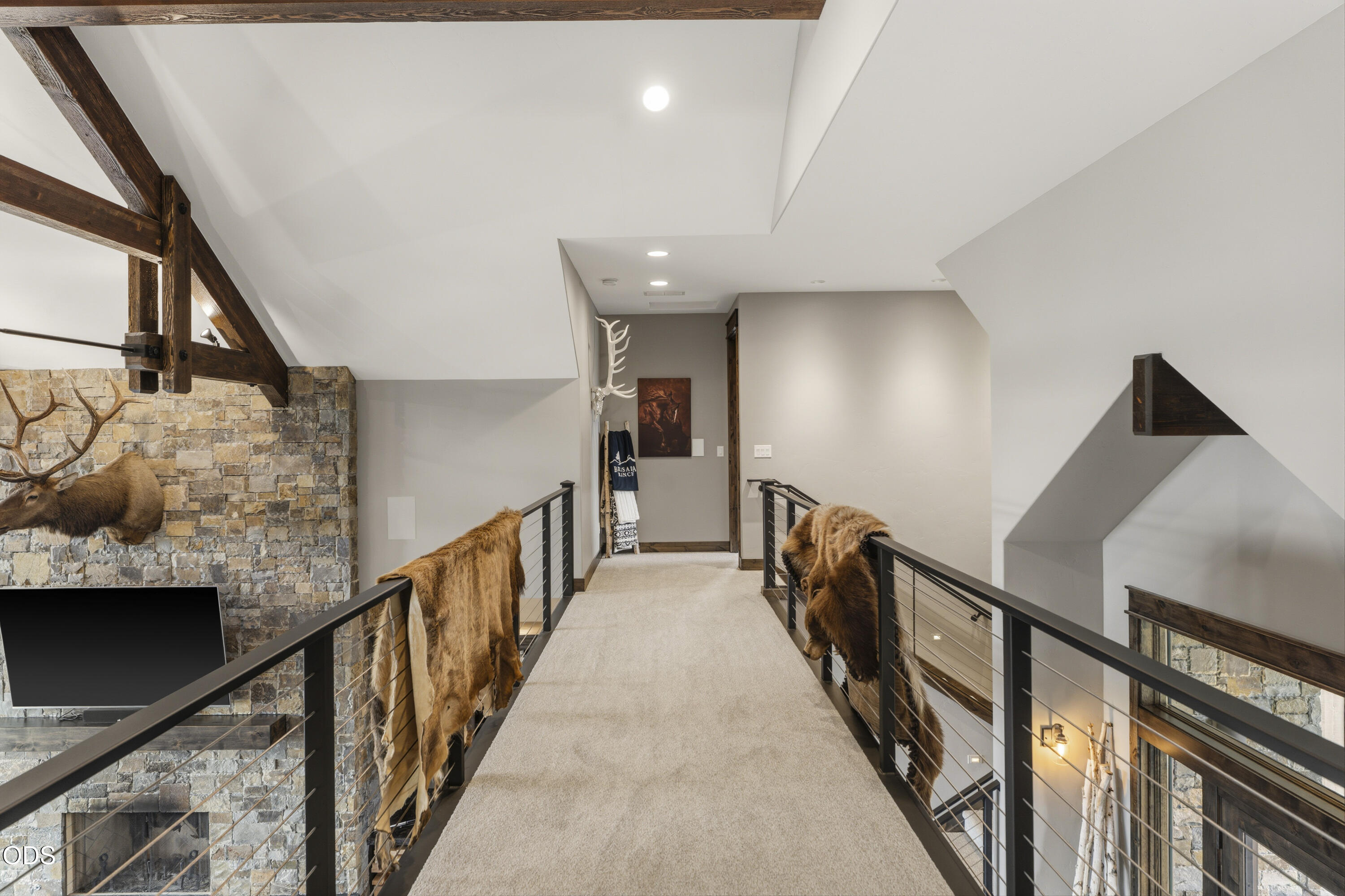 15935 South W Brasada Ranch Road Powell Butte, OR 97753 - Photo 23 of 45 a view of a hallway with wooden floor and staircase