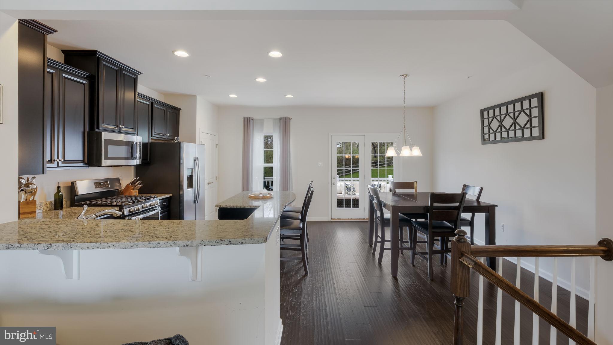 235 Ashburn Road Phoenixville, PA 19460 - Photo 11 of 31 a view of a dining room with furniture window and wooden floor