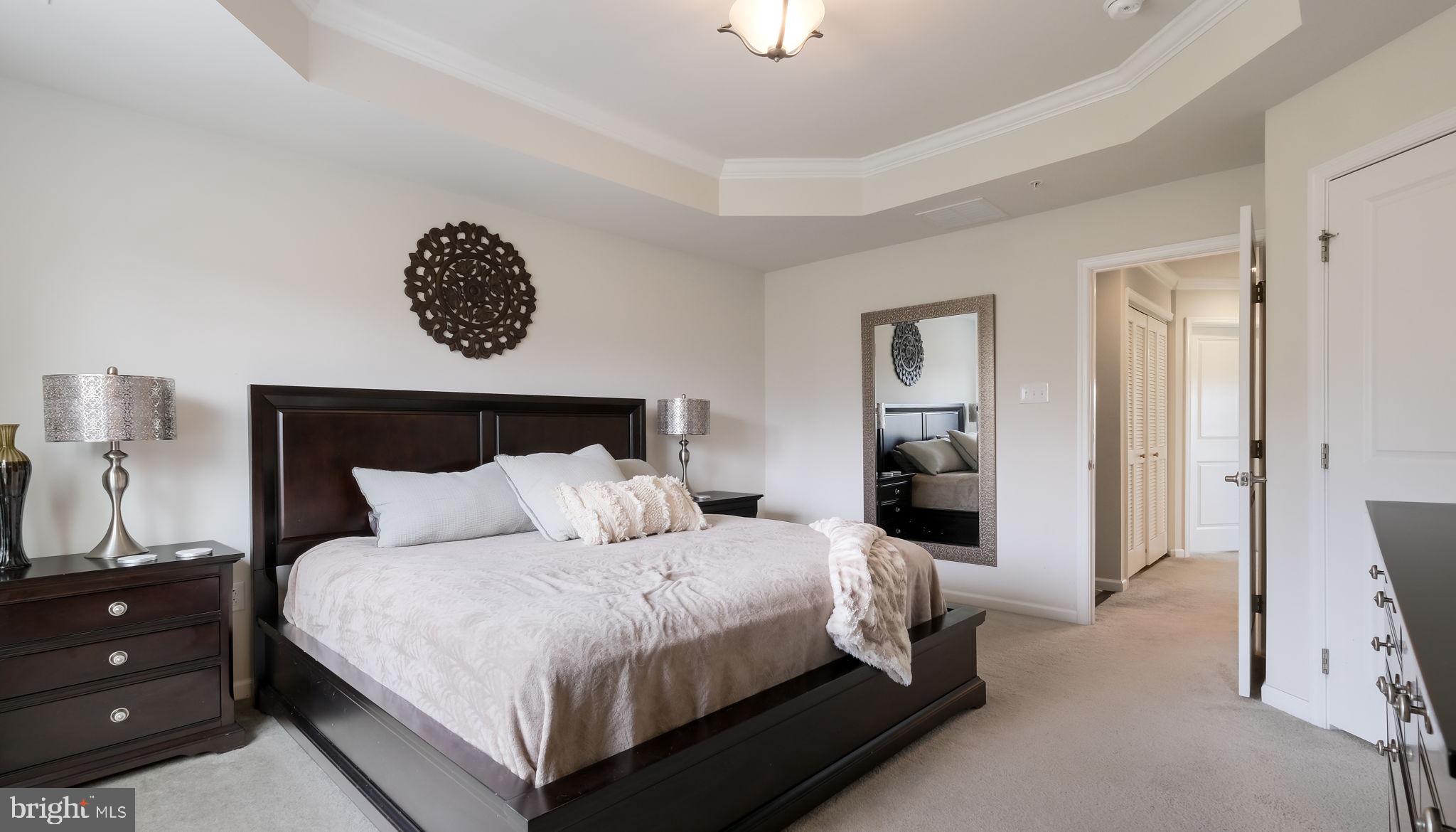235 Ashburn Road Phoenixville, PA 19460 - Photo 21 of 31 a bedroom with a bed and a lamp on dresser