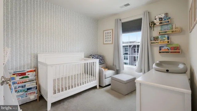 a bedroom with furniture and a book shelf