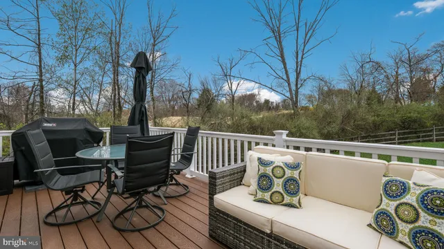 a view of a chairs and table on the deck