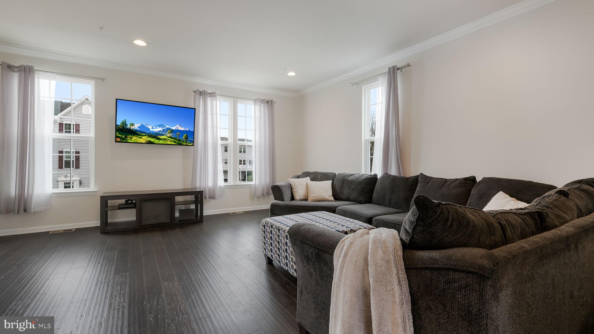 235 Ashburn Road Phoenixville, PA 19460 - Photo 7 of 31 a living room with furniture and wooden floor
