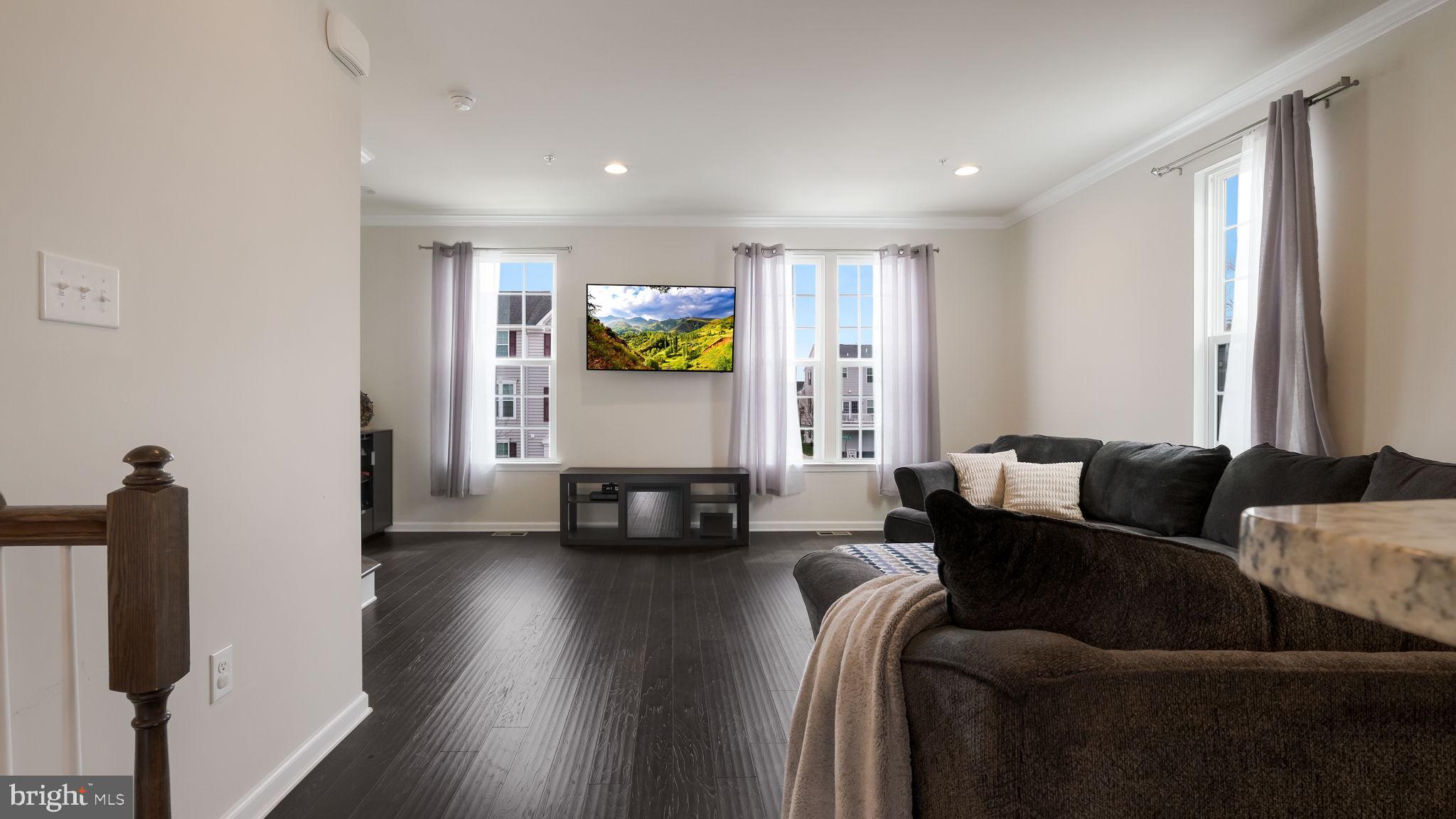 235 Ashburn Road Phoenixville, PA 19460 - Photo 10 of 31 a living room with furniture and a flat screen tv