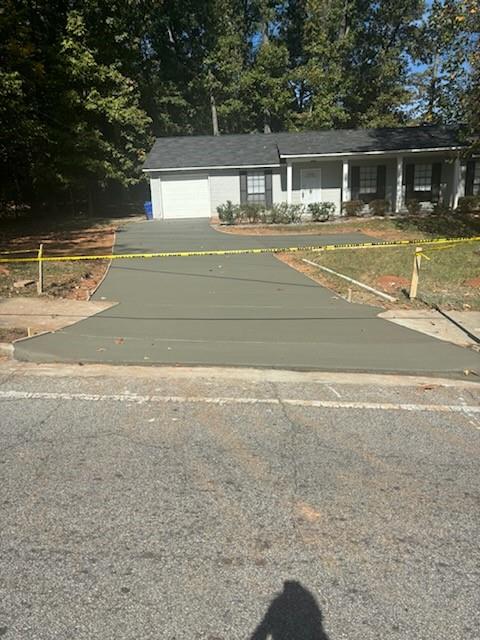 5490 Marbut Road Lithonia, GA 30058 - Photo 19 of 19 a front view of a house with a yard