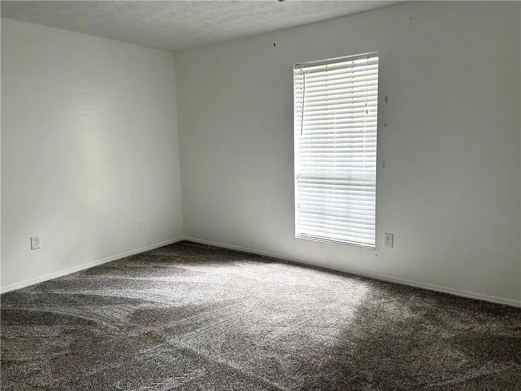 5490 Marbut Road Lithonia, GA 30058 - Photo 3 of 19 an empty room with a window