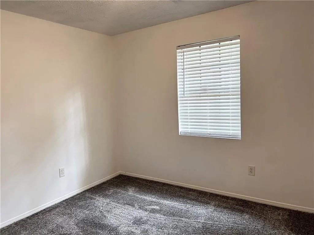5490 Marbut Road Lithonia, GA 30058 - Photo 6 of 19 an empty room with a window