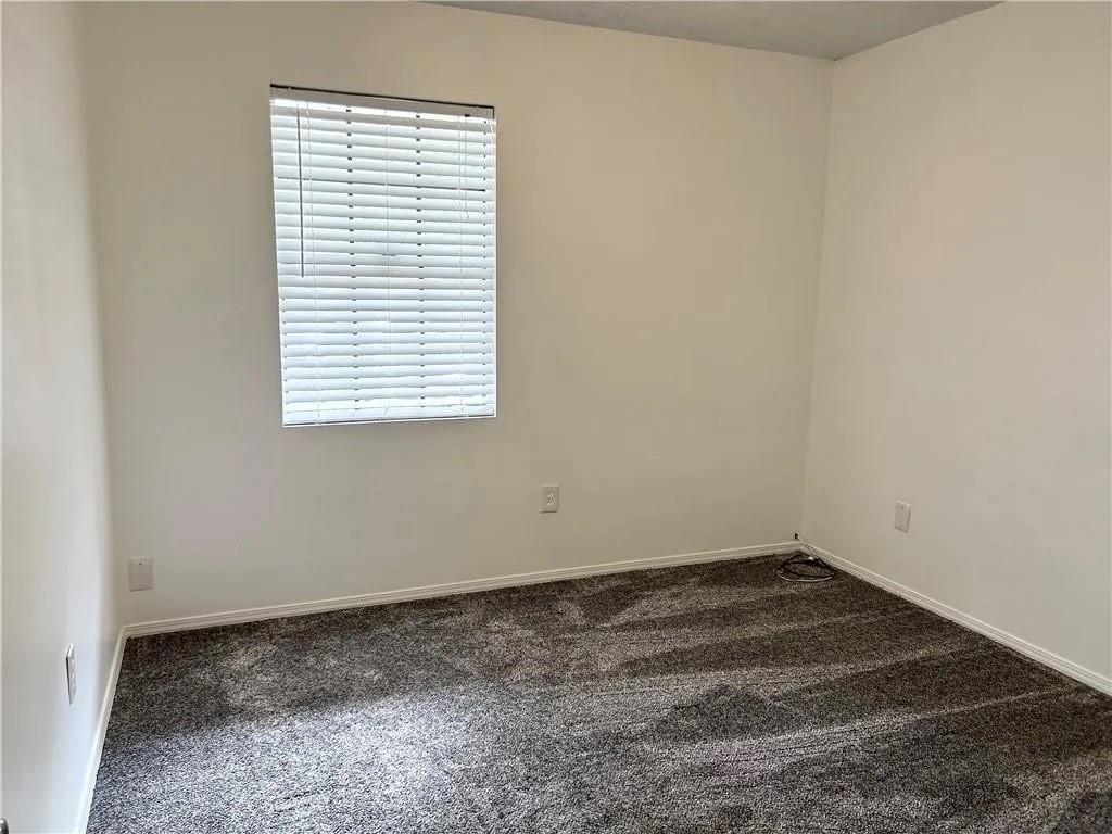 5490 Marbut Road Lithonia, GA 30058 - Photo 8 of 19 an empty room with a window