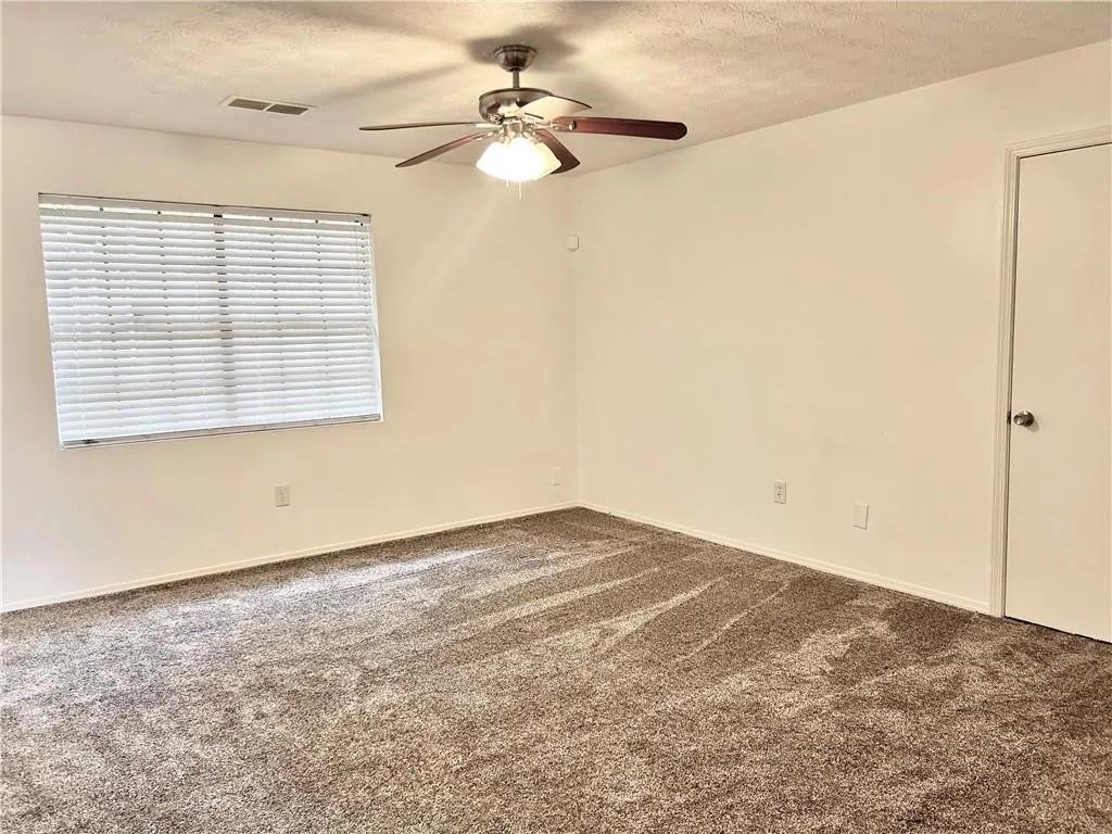 5490 Marbut Road Lithonia, GA 30058 - Photo 9 of 19 a view of empty room with window
