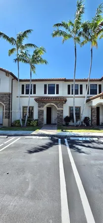 a front view of a house with a swimming pool
