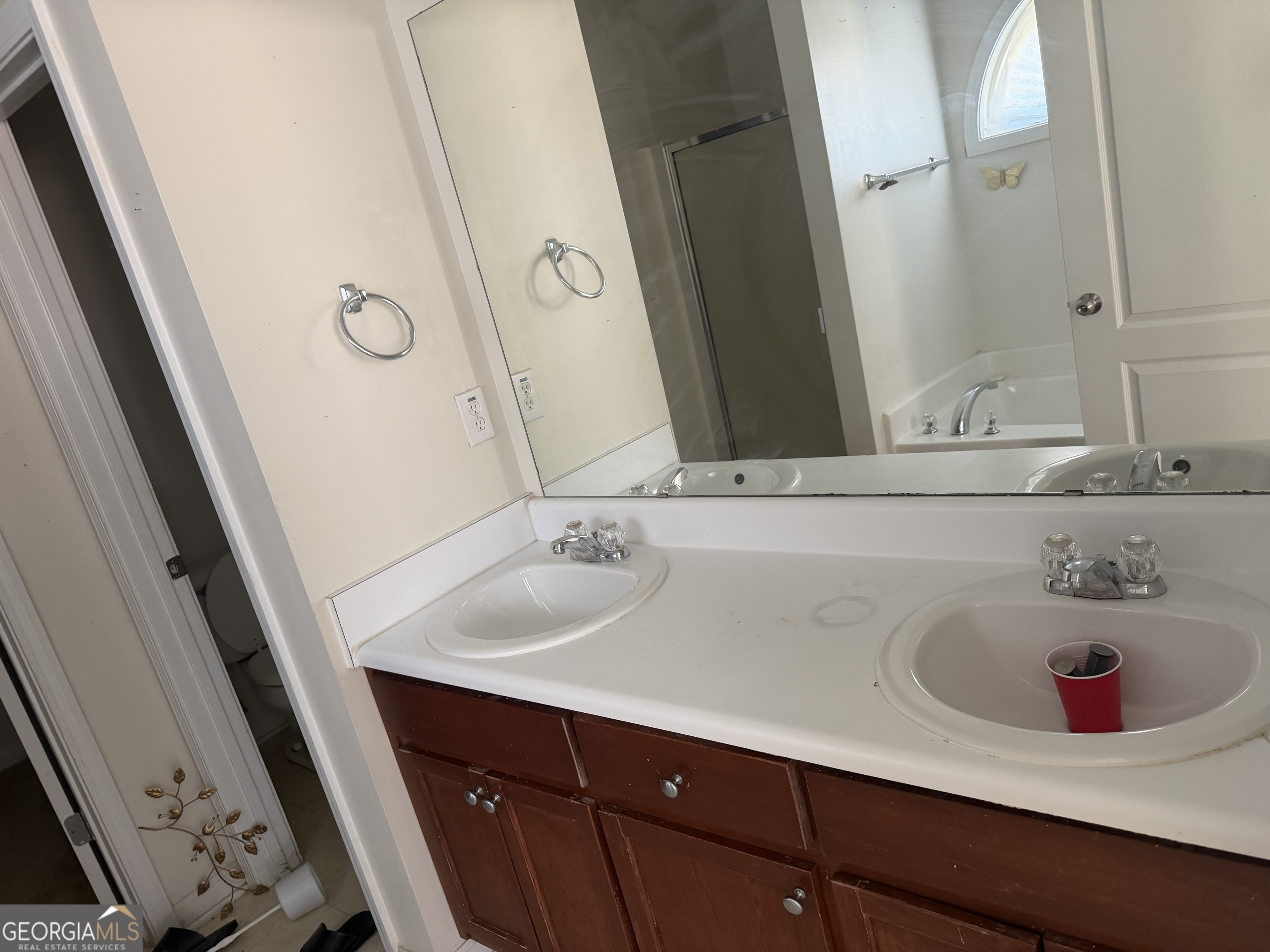 3868 Twin Ridge Lane Ellenwood, GA 30294 - Photo 13 of 16 a bathroom with a sink and a mirror