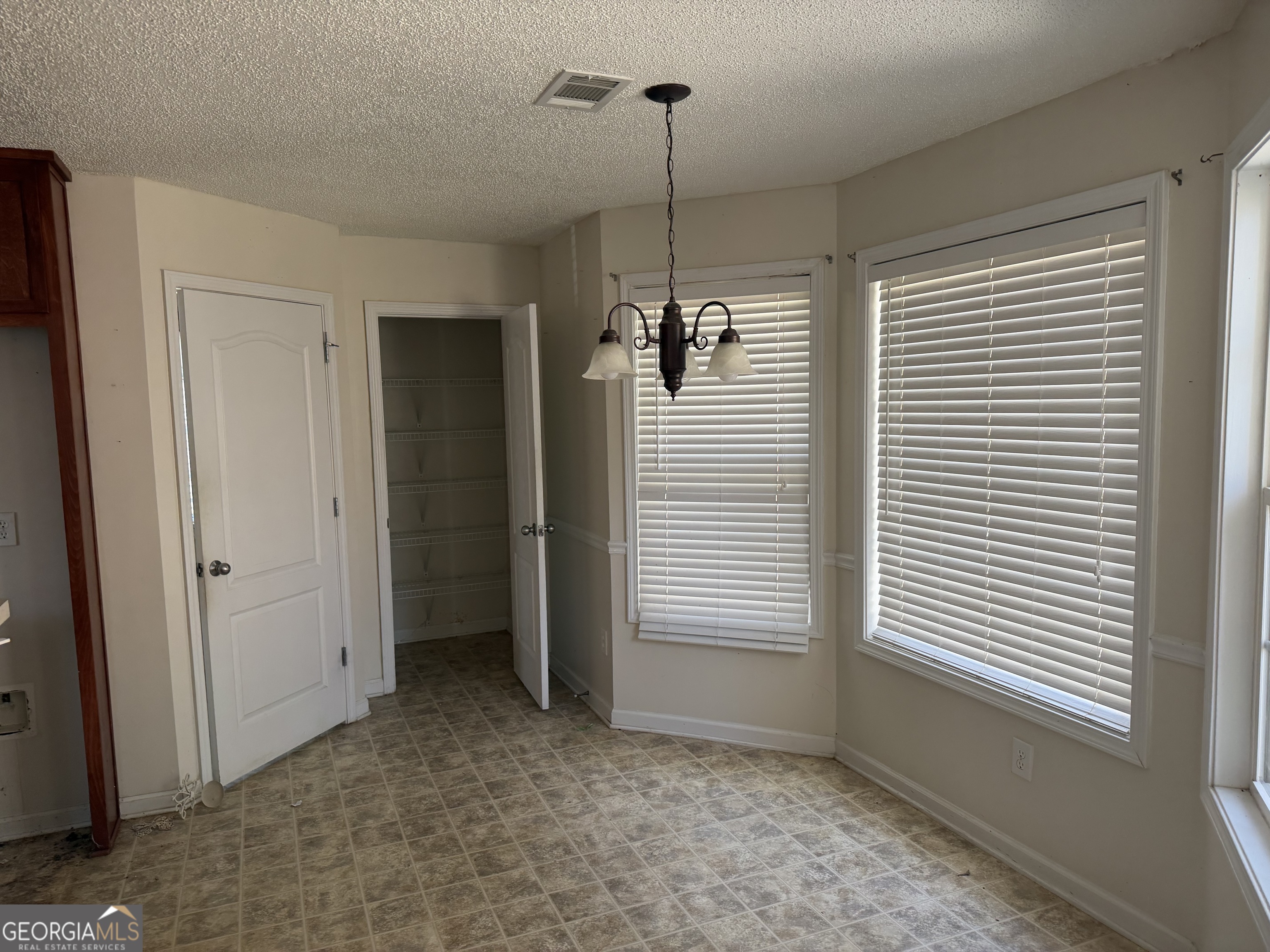 3868 Twin Ridge Lane Ellenwood, GA 30294 - Photo 8 of 16 a view of a room with a window and brick wall