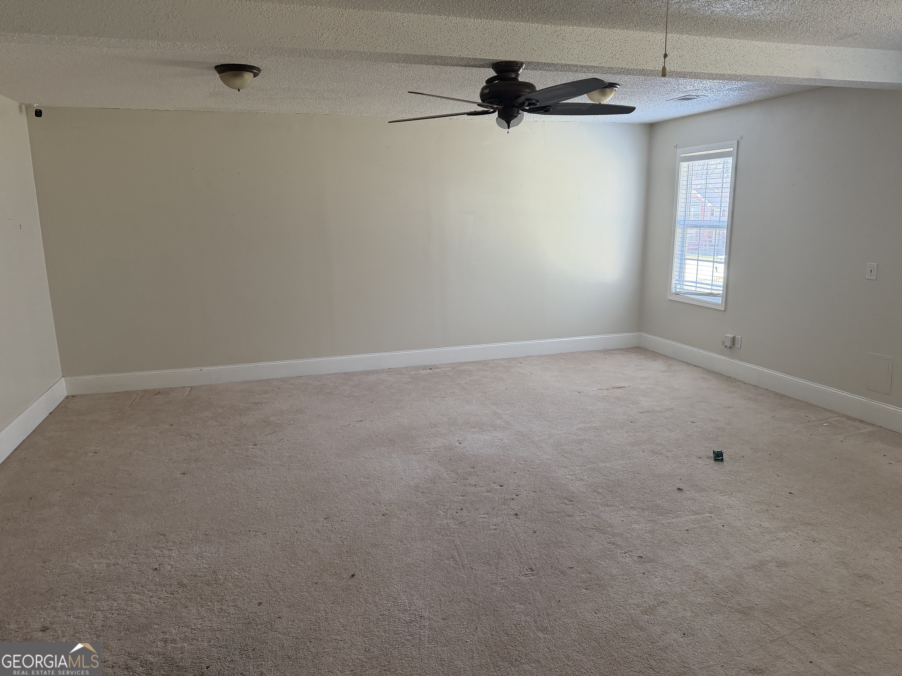 3868 Twin Ridge Lane Ellenwood, GA 30294 - Photo 10 of 16 a view of an empty room with a window