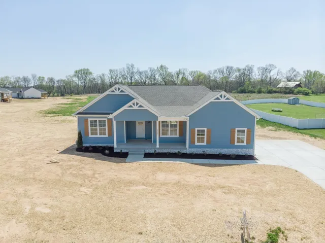 a house with trees in the background