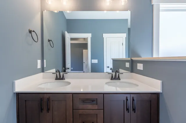 a bathroom with a bathtub and a sink