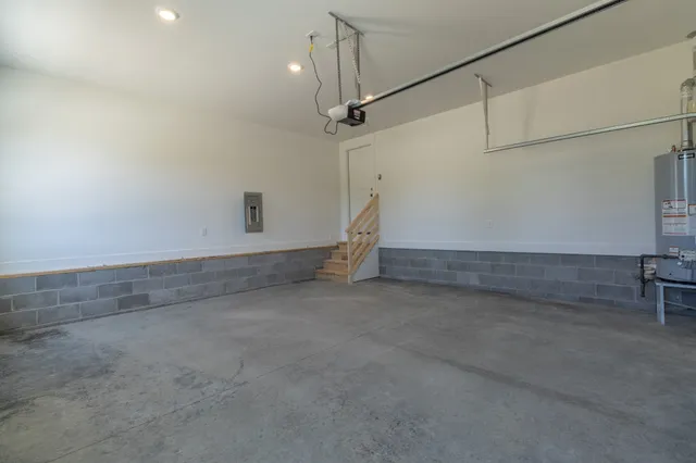 a view of a balcony with wooden floor & fence