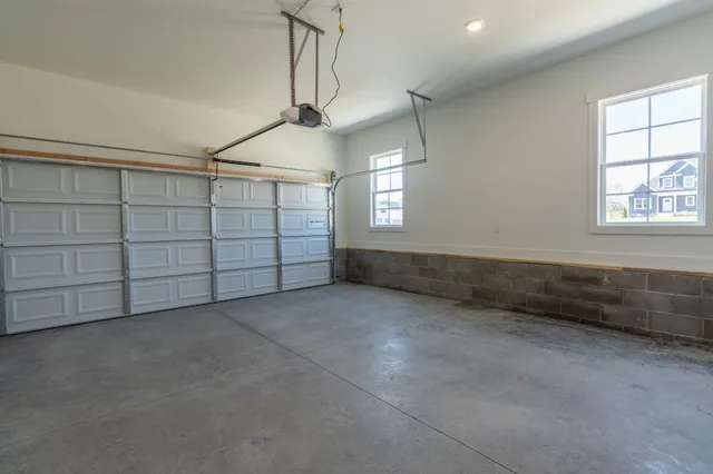 a view of a house with a wooden fence