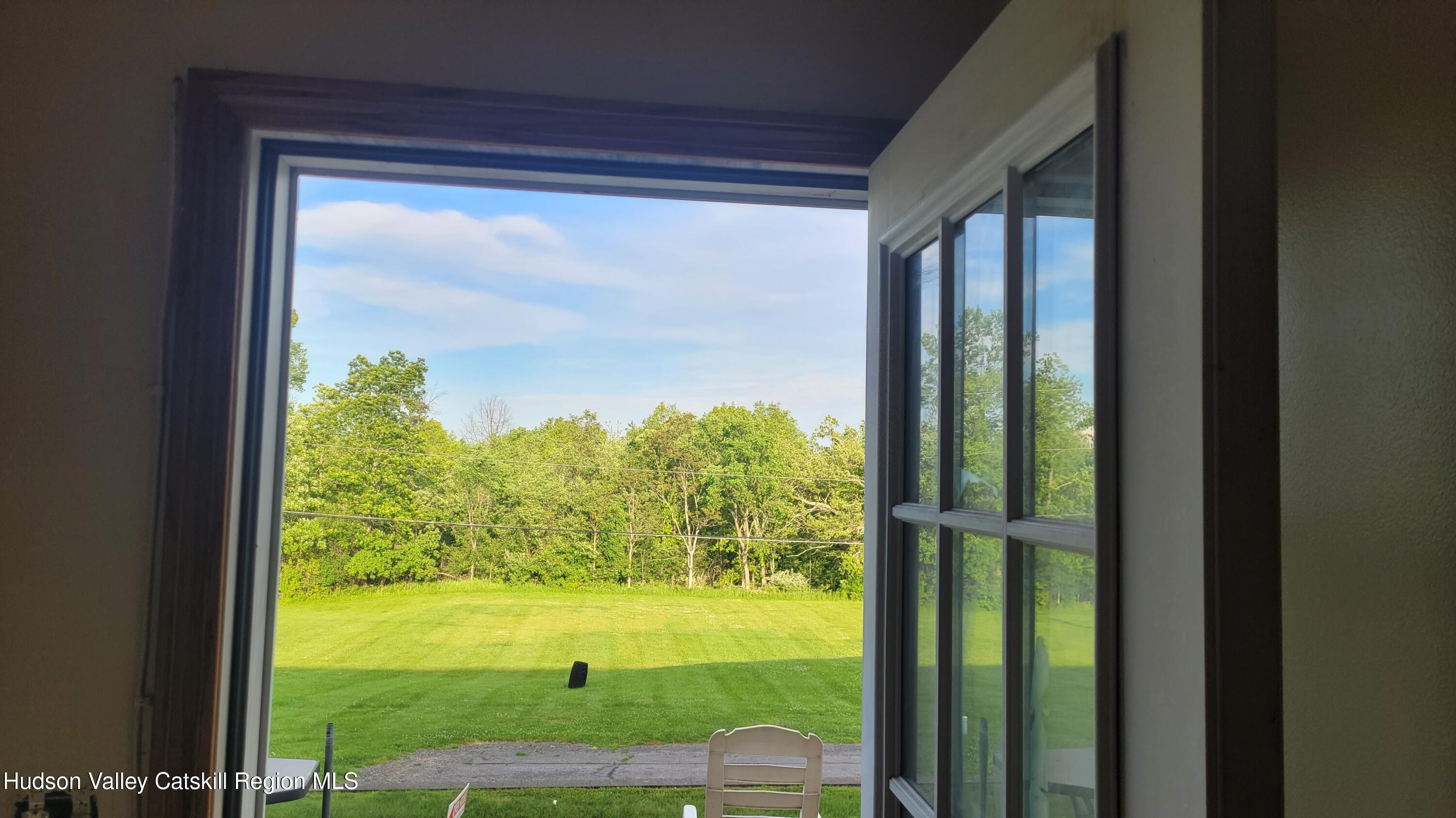 881 Albany Post Road, Unit 5 New Paltz, NY 12561 - Photo 16 of 16 a view of a yard from a window