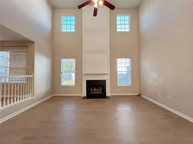 a view of kitchen with window and refrigerator