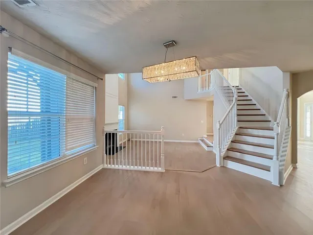 a kitchen with granite countertop a stove and cabinets